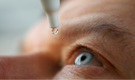 Rhopressa eye drops being placed into an eye.